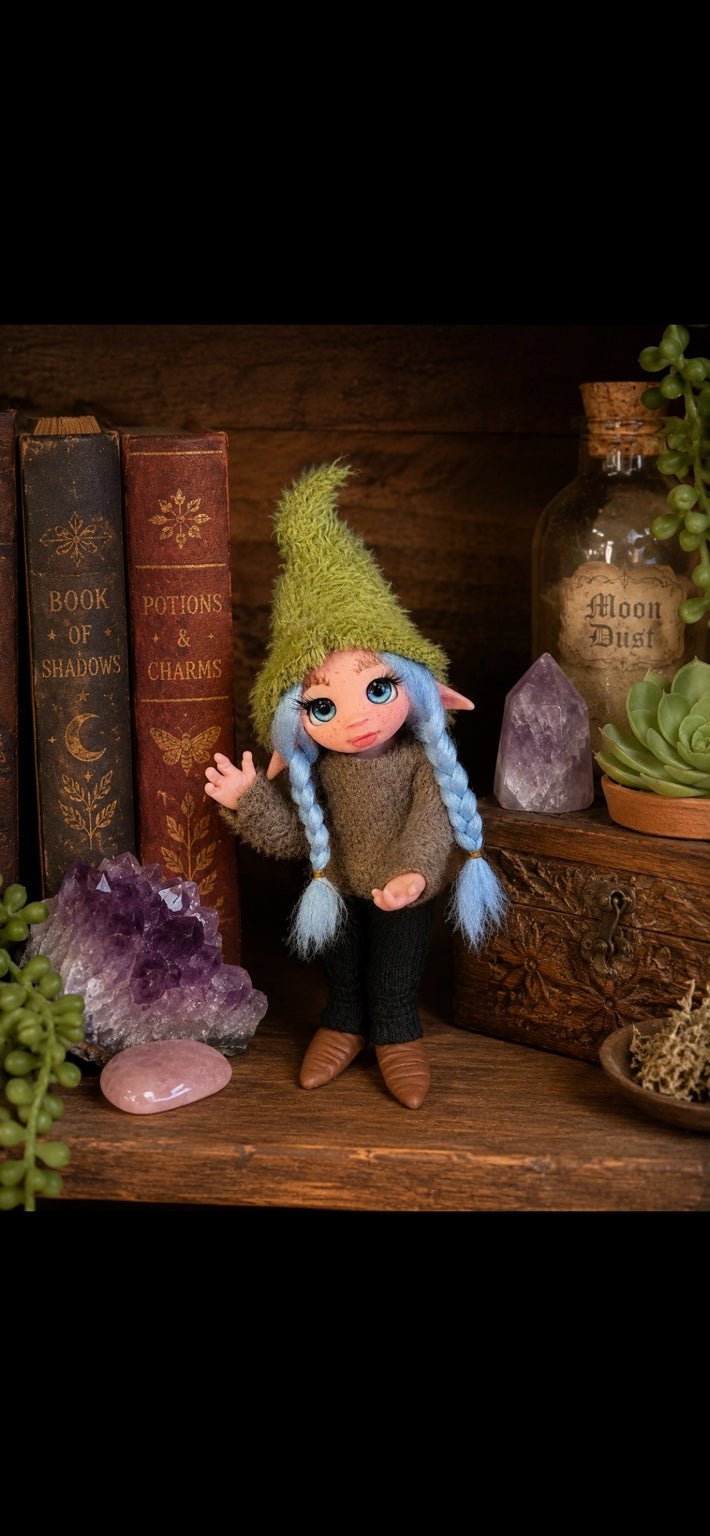 Nirea handmade Pixie with blue braids among crystals and magical books