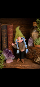 Nirea handmade Pixie with blue braids among crystals and magical books