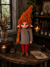Orivelle handmade Pixie in a warm botanical room with books and candlelight