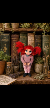 Ruvella handmade Pixie with red pigtails among botanical books and dried flowers