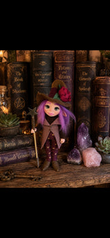 Sorelia handmade Pixie with rose hat and star staff among magical books and crystals