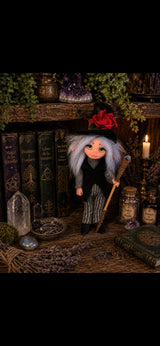 Thalvera handmade Pixie with red rose hat and amethyst staff among magical books and crystals