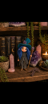 Vaelith handmade Pixie with blue hair, amethyst hat and crystal staff among cosmic books
